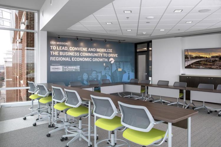Conference room lit by commercial office lighting