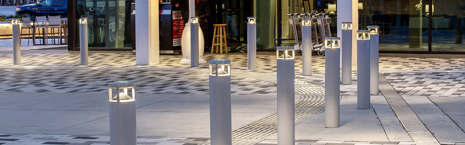 A walkway guarded by commercial outdoor bollard lighting